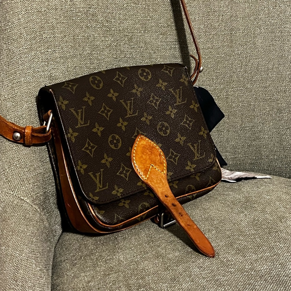 True vintage adjustable leather shoulder strap. Monogram Canvas Cartouchiere PM